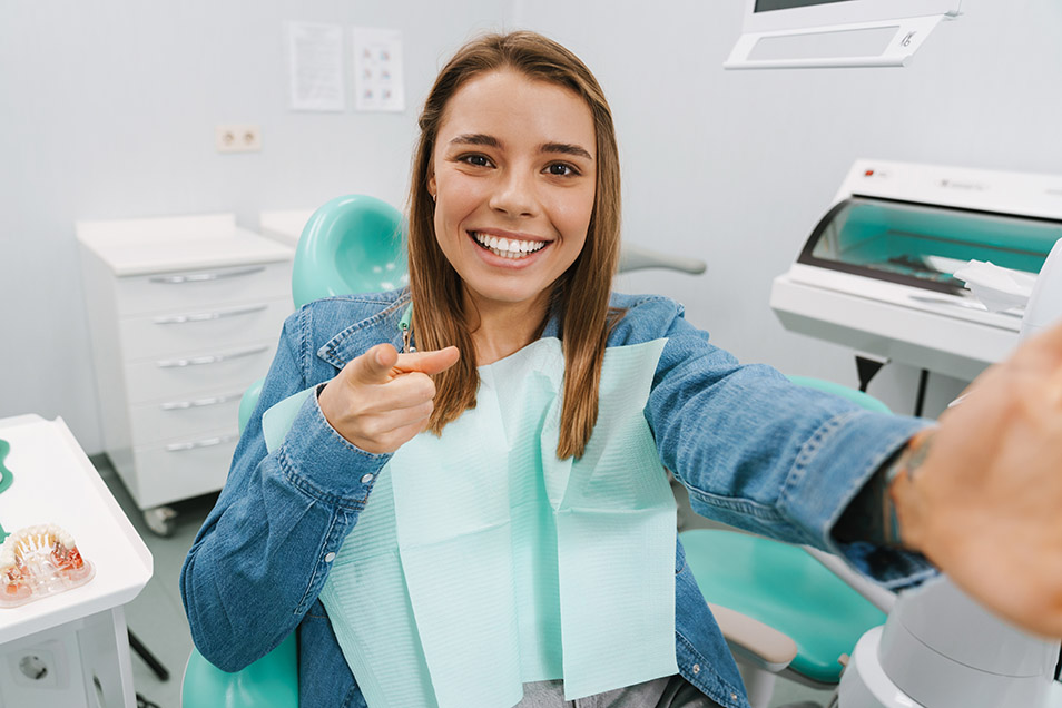 girl happy after having dental bridge installed