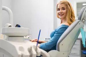 patient at dentists office smiling