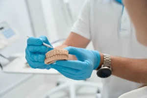 dentist removes plaque from teeth